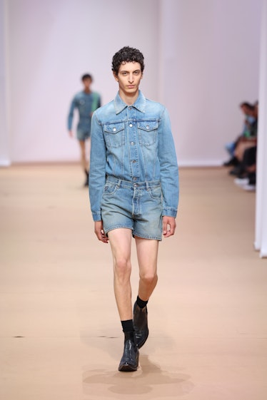 MILAN, ITALY - JUNE 19: A model walks the runway at the Prada fashion show during the Milan Fashion ...